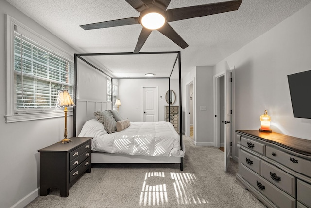 236 Slayden Cir, Clarksville, TN 37040 - bedroom with a textured ceiling, light colored carpet, and a ceiling fan