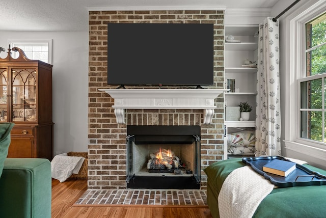 236 Slayden Cir, Clarksville, TN 37040 - living room featuring wood finished floors and a brick fireplace
