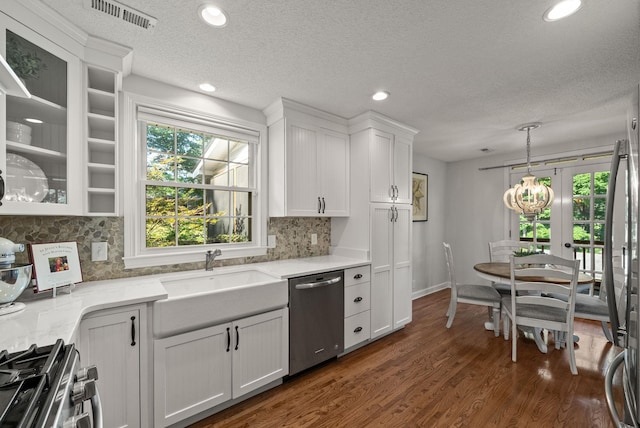 236 Slayden Cir, Clarksville, TN 37040 - kitchen featuring appliances with stainless steel finishes, white cabinets, tasteful backsplash, dark wood-style floors, and recessed lighting