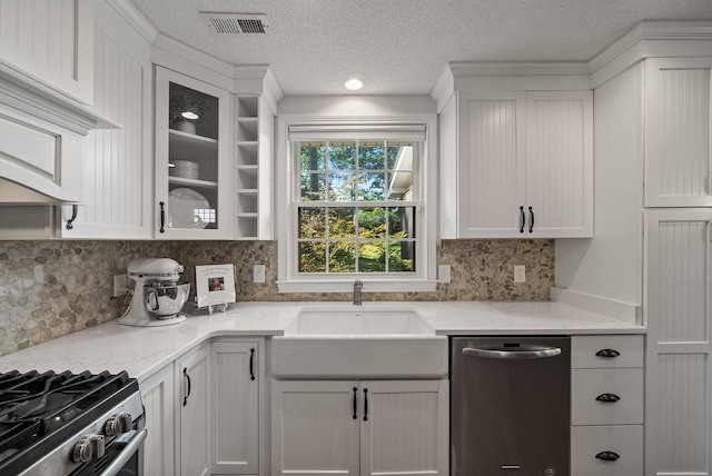 236 Slayden Cir, Clarksville, TN 37040 - kitchen with stainless steel dishwasher, a textured ceiling, decorative backsplash, white cabinetry, and light stone countertops