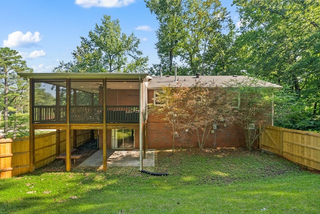 236 Slayden Cir, Clarksville, TN 37040 - rear view of house with a sunroom, a patio, brick siding, and ceiling fan