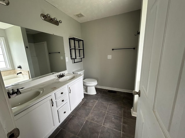 3421 Foxrun Ln, Clarksville, TN 37042 - bathroom featuring double vanity and a textured ceiling