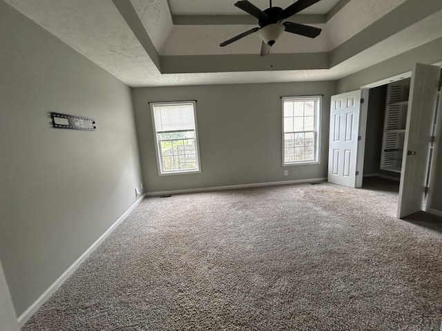 3421 Foxrun Ln, Clarksville, TN 37042 - unfurnished bedroom featuring carpet floors, a raised ceiling, and a ceiling fan