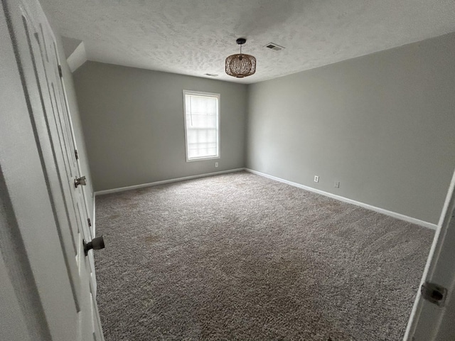 3421 Foxrun Ln, Clarksville, TN 37042 - carpeted spare room featuring a textured ceiling and baseboards