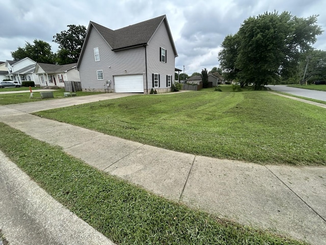 3421 Foxrun Ln, Clarksville, TN 37042 - view of home's exterior with a garage, driveway, a yard, and a residential view