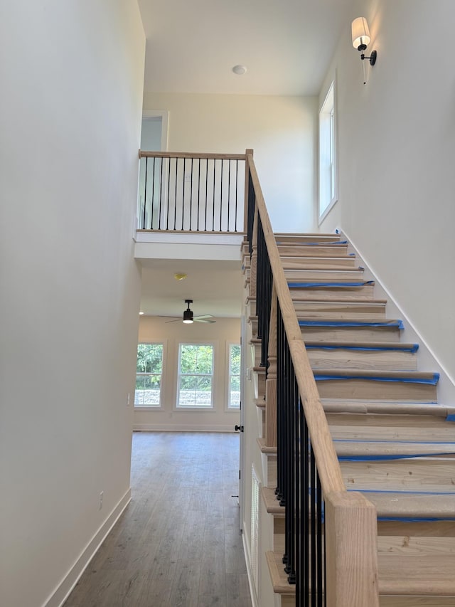 317 Wesson Dr, Clarksville, TN 37043 - stairway with wood finished floors and ceiling fan