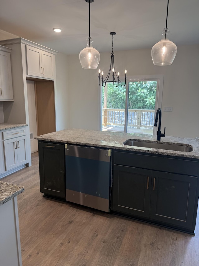 317 Wesson Dr, Clarksville, TN 37043 - kitchen featuring dishwashing machine, light wood-style floors, light stone counters, pendant lighting, and recessed lighting