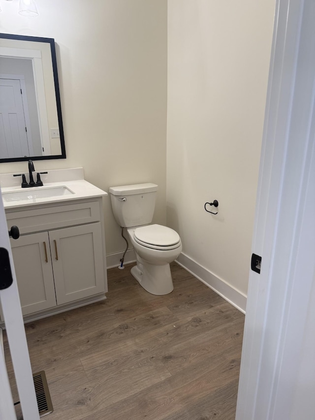 317 Wesson Dr, Clarksville, TN 37043 - half bathroom featuring vanity and wood finished floors