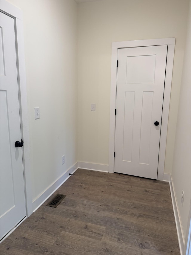317 Wesson Dr, Clarksville, TN 37043 - doorway with dark wood-style flooring and baseboards