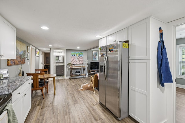813 Lonnie St, Columbia, TN 38401 - kitchen with stainless steel fridge, light wood-style floors, white cabinets, and recessed lighting