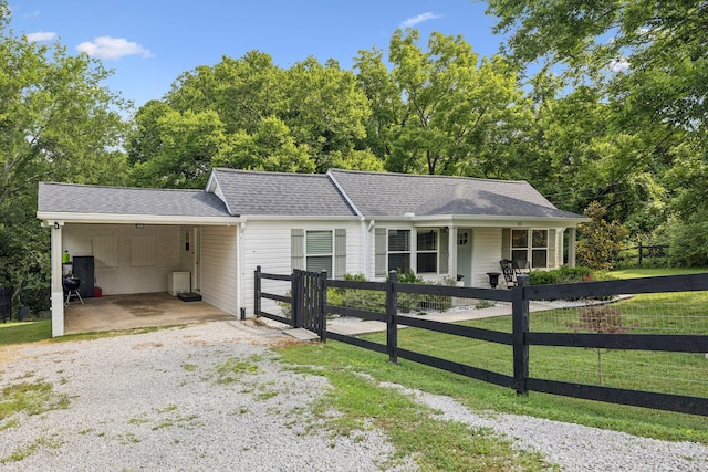 813 Lonnie St, Columbia, TN 38401 - single story home with a fenced front yard, an attached carport, driveway, and a porch