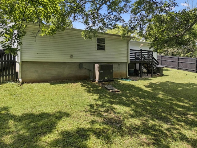 813 Lonnie St, Columbia, TN 38401 - rear view of property with a fenced backyard, a deck, and stairway