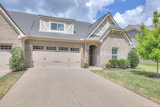 213 Vintage Way, Lebanon, TN 37087 - view of front of property with concrete driveway, a garage, roof with shingles, a front lawn, and brick siding