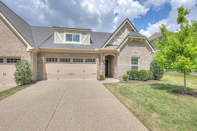 213 Vintage Way, Lebanon, TN 37087 - view of front of home featuring driveway, a shingled roof, brick siding, and an attached garage