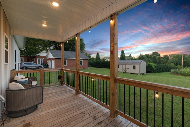 204 Locust St, Mc Ewen, TN 37101 - deck at dusk with an outdoor structure and a lawn