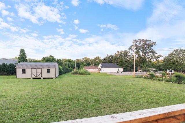204 Locust St, Mc Ewen, TN 37101 - view of green lawn with a storage shed