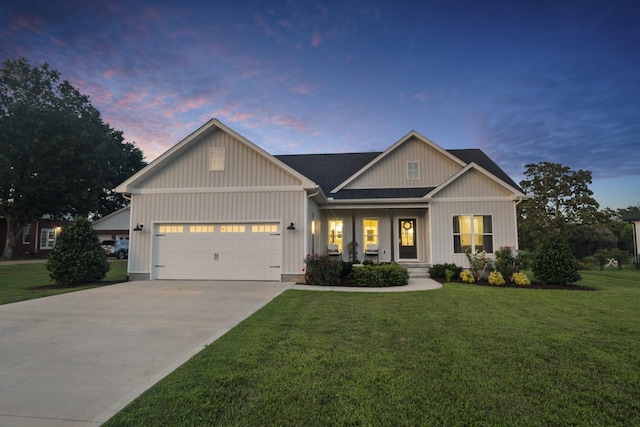 204 Locust St, Mc Ewen, TN 37101 - view of front of home with concrete driveway, a front lawn, a garage, and board and batten siding