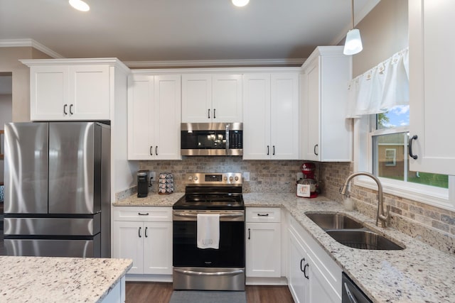 204 Locust St, Mc Ewen, TN 37101 - kitchen with stainless steel appliances, white cabinets, tasteful backsplash, light stone counters, and crown molding