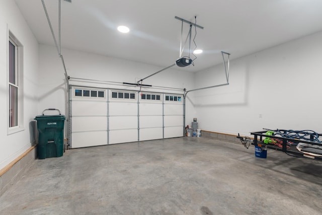204 Locust St, Mc Ewen, TN 37101 - garage featuring a garage door opener and recessed lighting