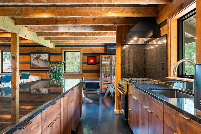 3360 Sweeney Hollow Rd, Franklin, TN 37064 - kitchen with wall chimney range hood, stainless steel gas range, healthy amount of natural light, beam ceiling, and dark stone counters