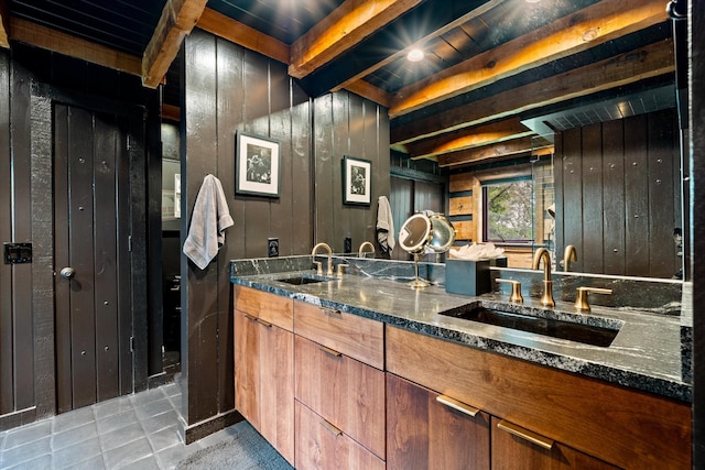 3360 Sweeney Hollow Rd, Franklin, TN 37064 - full bathroom featuring double vanity, wood walls, tile patterned flooring, and beam ceiling