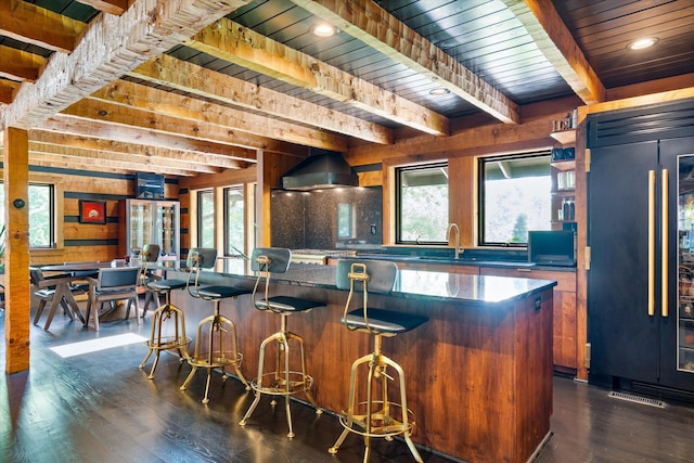 3360 Sweeney Hollow Rd, Franklin, TN 37064 - bar area with paneled refrigerator, dark wood finished floors, a wooden ceiling with exposed beams, and wooden walls