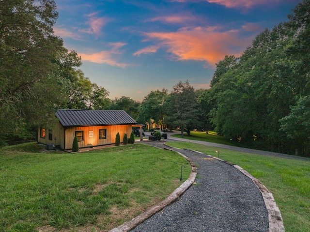 3360 Sweeney Hollow Rd, Franklin, TN 37064 - exterior space with a standing seam roof, a metal roof, driveway, a front lawn, and board and batten siding