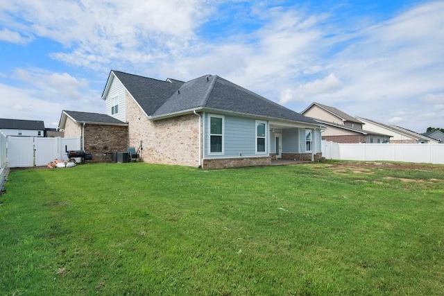 2412 Bullrush Ln, Murfreesboro, TN 37128 - back of property featuring brick siding, a fenced backyard, and roof with shingles