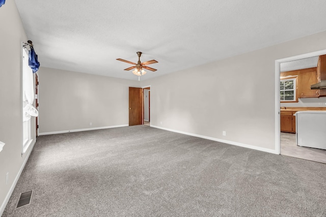 207 Short St, Clarksville, TN 37042 - unfurnished room featuring light colored carpet, a ceiling fan, and a textured ceiling