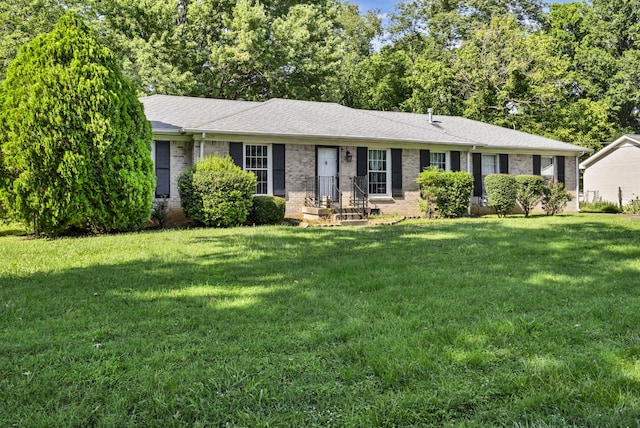 207 Short St, Clarksville, TN 37042 - ranch-style home with brick siding, a front lawn, and a shingled roof
