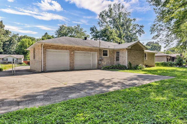 207 Short St, Clarksville, TN 37042 - single story home with driveway, an attached garage, brick siding, and a gate