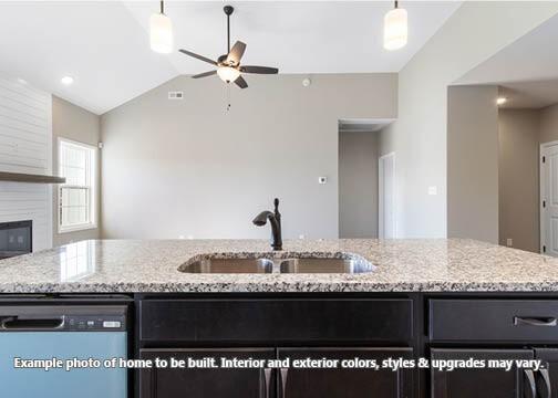 918 Vendue Ave, Clarksville, TN 37042 - kitchen with dishwashing machine, ceiling fan, lofted ceiling, light stone countertops, and pendant lighting