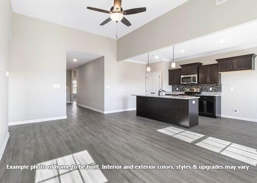 918 Vendue Ave, Clarksville, TN 37042 - kitchen with stainless steel microwave, a ceiling fan, dark wood-type flooring, light countertops, and open floor plan