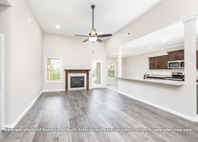 914 Vendue Ave, Clarksville, TN 37042 - unfurnished living room with ornate columns, ceiling fan, plenty of natural light, and recessed lighting