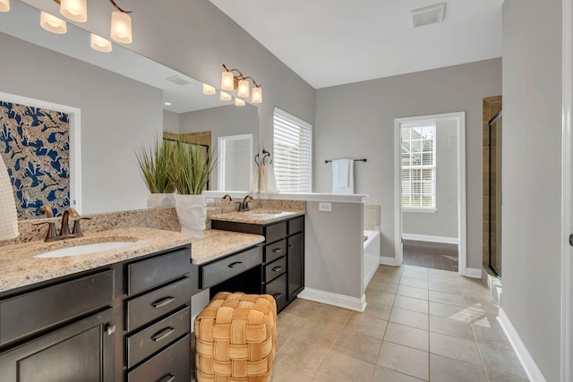 412 Warren Hill Dr, Mount Juliet, TN 37122 - full bathroom with double vanity, a garden tub, a stall shower, and tile patterned flooring