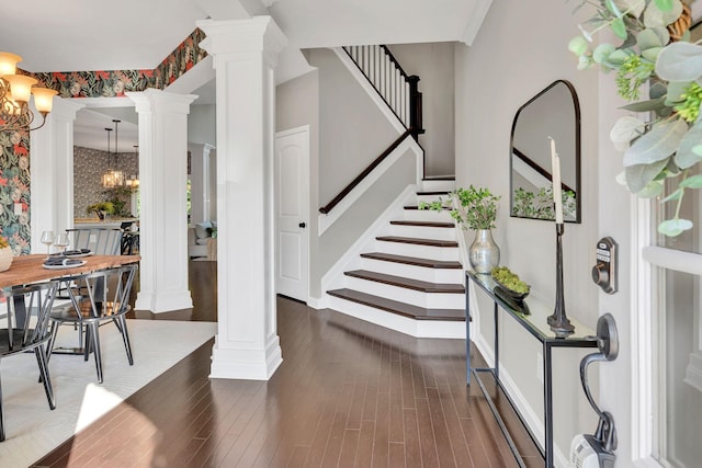 412 Warren Hill Dr, Mount Juliet, TN 37122 - foyer with decorative columns, stairs, a chandelier, and dark wood-style flooring