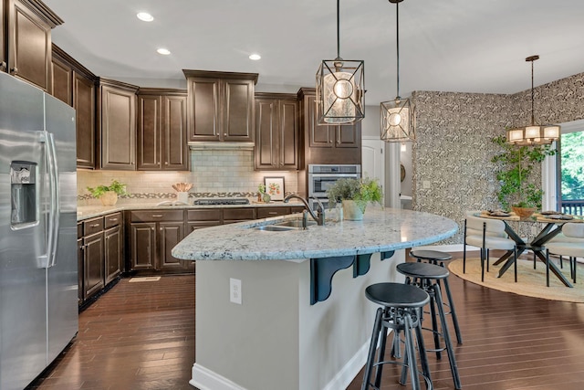 412 Warren Hill Dr, Mount Juliet, TN 37122 - kitchen with appliances with stainless steel finishes, dark brown cabinets, dark wood-style floors, and recessed lighting