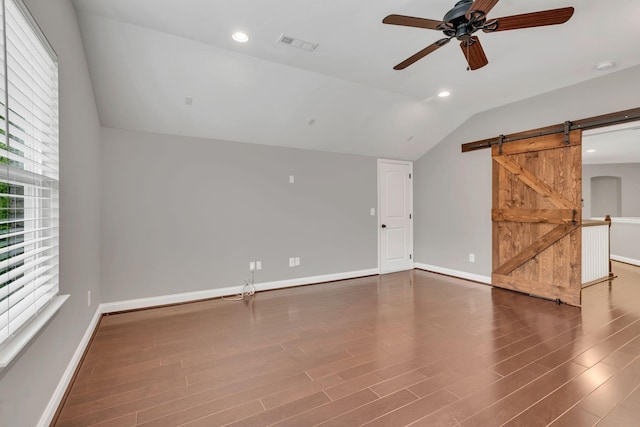 412 Warren Hill Dr, Mount Juliet, TN 37122 - empty room with lofted ceiling, a ceiling fan, a barn door, plenty of natural light, and wood finished floors