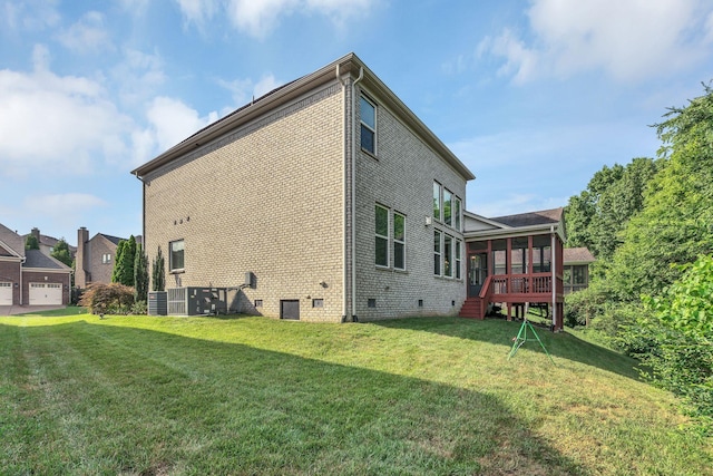 412 Warren Hill Dr, Mount Juliet, TN 37122 - rear view of house with a sunroom, crawl space, a lawn, and brick siding