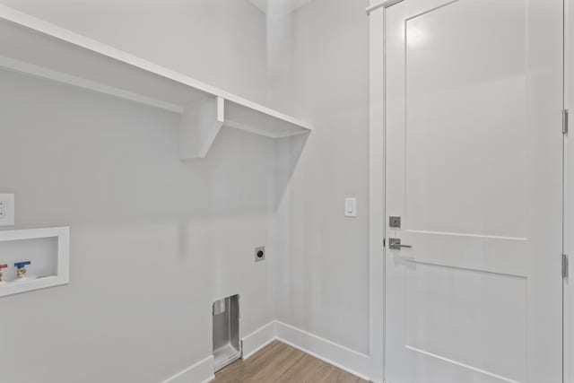 316 Campfire Ct, Winchester, TN 37398 - washroom with electric dryer hookup, washer hookup, and light wood-style floors