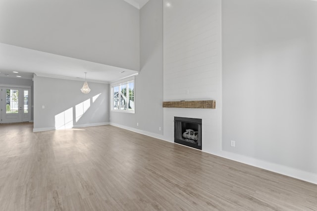 316 Campfire Ct, Winchester, TN 37398 - unfurnished living room with wood finished floors, healthy amount of natural light, and a large fireplace