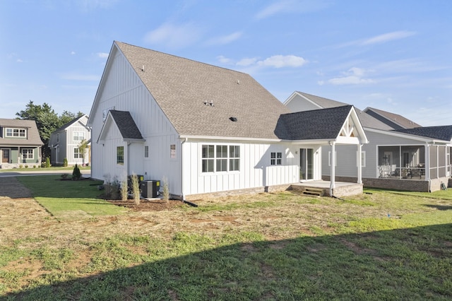 316 Campfire Ct, Winchester, TN 37398 - rear view of property featuring a shingled roof, board and batten siding, a lawn, and a sunroom