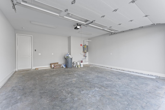 316 Campfire Ct, Winchester, TN 37398 - garage with a garage door opener and water heater