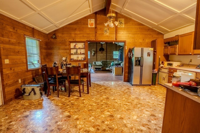 366 Ridge Rd, Westpoint, TN 38486 - dining area featuring lofted ceiling, wood walls, and light floors