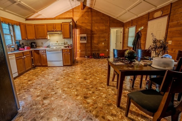 366 Ridge Rd, Westpoint, TN 38486 - kitchen featuring white appliances, vaulted ceiling, under cabinet range hood, wood walls, and brown cabinetry