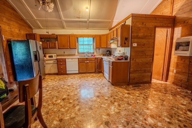 366 Ridge Rd, Westpoint, TN 38486 - kitchen featuring white appliances, wooden walls, brown cabinets, vaulted ceiling, and light countertops