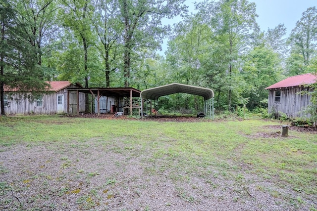 366 Ridge Rd, Westpoint, TN 38486 - view of green lawn featuring a carport and an outdoor structure