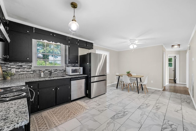 1872 River Rd, Clarksville, TN 37040 - kitchen featuring stainless steel appliances, dark cabinets, light marble finish floors, backsplash, and crown molding