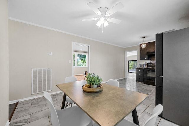 1872 River Rd, Clarksville, TN 37040 - dining room featuring light marble finish floors, crown molding, and ceiling fan