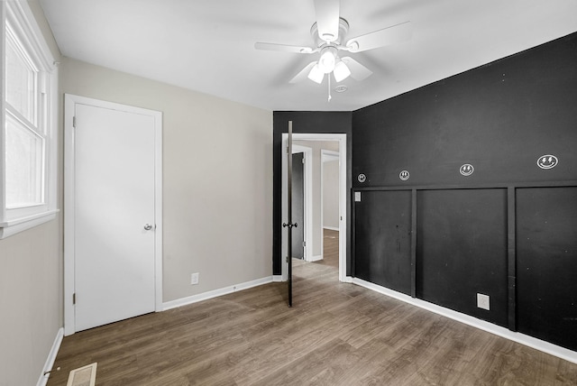 1872 River Rd, Clarksville, TN 37040 - unfurnished bedroom featuring wood finished floors and ceiling fan